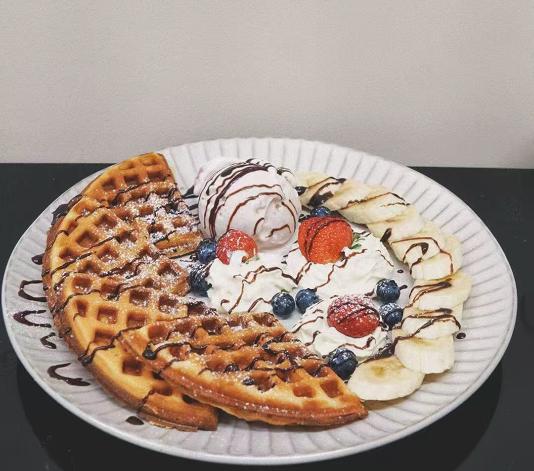 Waffle with gelato and chocolate drizzle